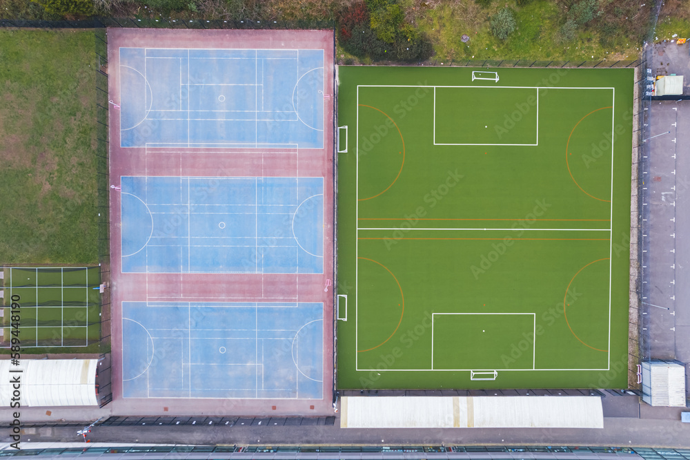 Aerial view over a sports facility, green football pitch . High quality photo