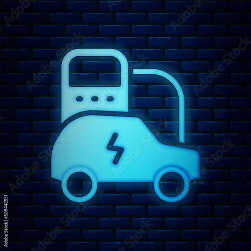 Glowing neon Electric car and electrical cable plug charging icon isolated on brick wall background. Renewable eco technologies. Vector