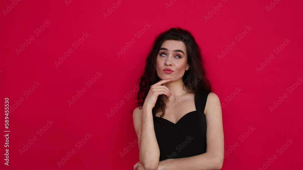 Young woman thinking over red background Young woman thinking over red background