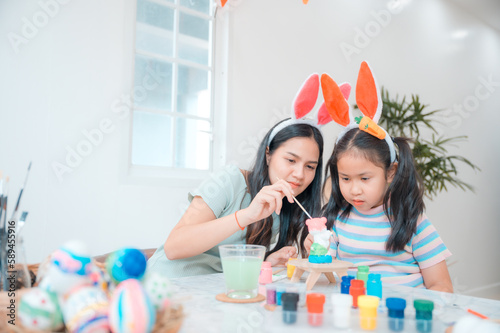 mother and child family making waster egg at home happy and fun together in holiday