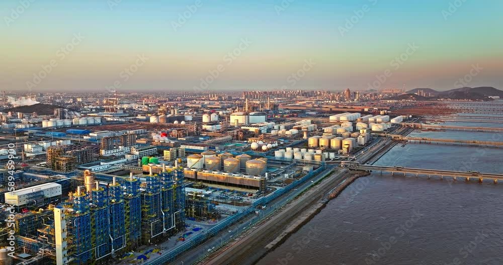 Aerial view of oil and gas petrochemical industrial with Refinery factory. Industrial zone building on the seaside. Aerial view of oil and gas petrochemical industrial with Refinery factory. Industrial zone building on the seaside.