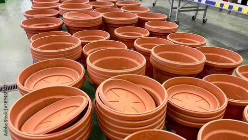 Close-up of empty flower pots in a store or greenhouse. Colorful pots for plants. Gardening and landscape design concept