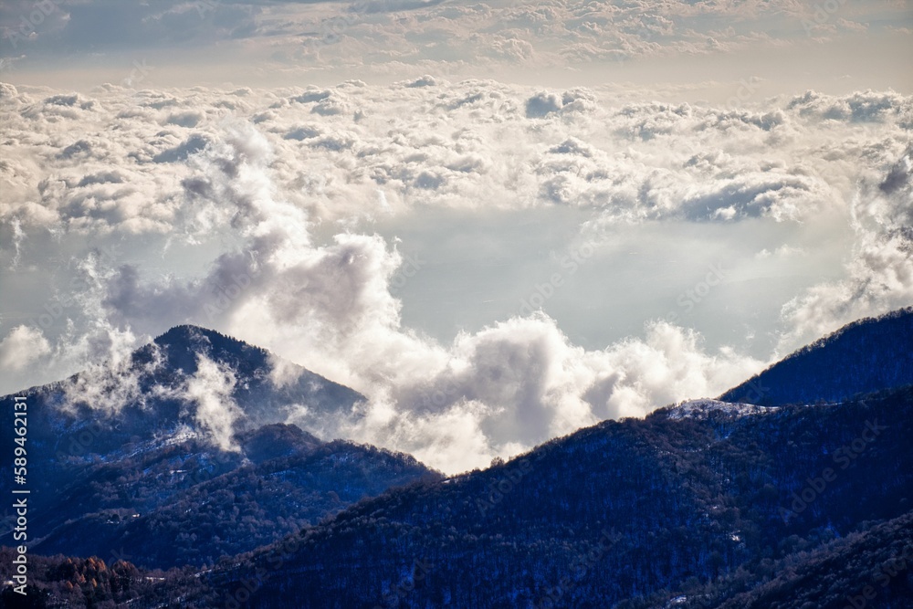 Beautiful shot of a mountainous landscape covered with clouds Beautiful shot of a mountainous landscape covered with clouds