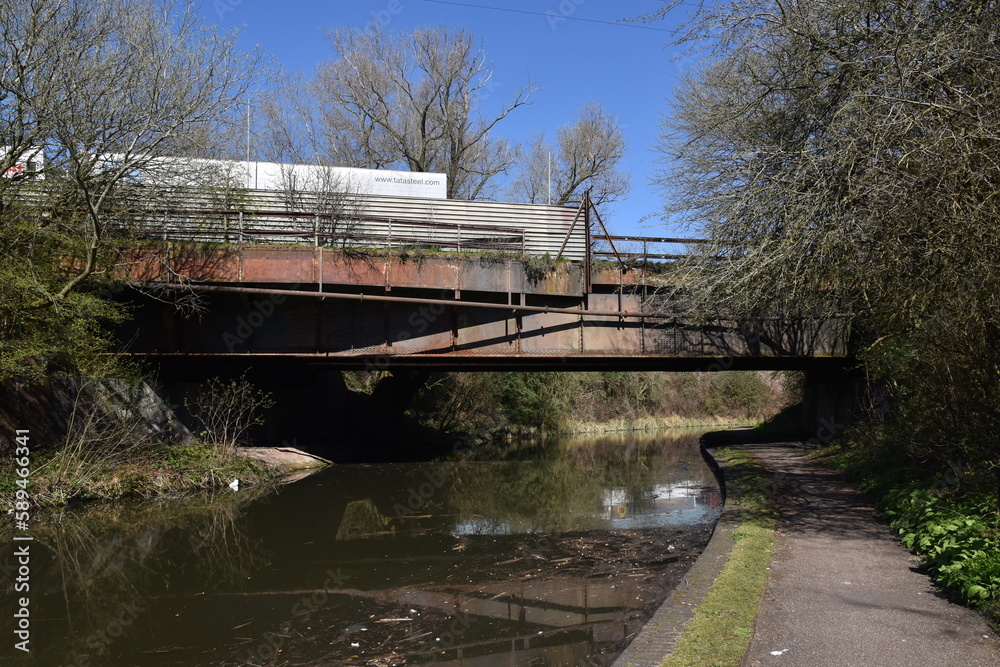 a walk along the dudley canal near brierley hill. going under an old bridge that goes over the canal a walk along the dudley canal near brierley hill. going under an old bridge that goes over the canal