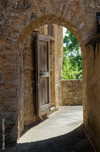 Vertical shot of an arched old door in Rothenburg ob der Tauber, Bavaria, Germany