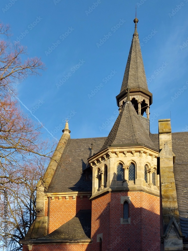 German chapel roof in sunlight with blue sky