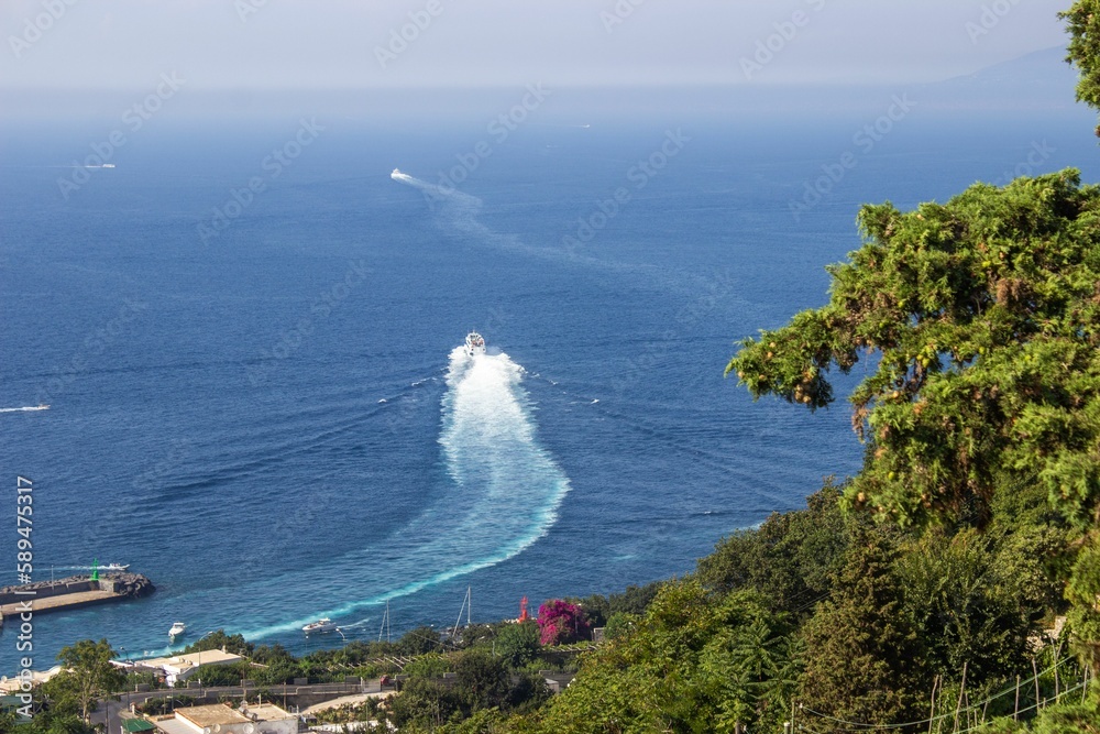 Fototapeta premium Beautiful shot of a boat in a sea near the Capri Island, Italy