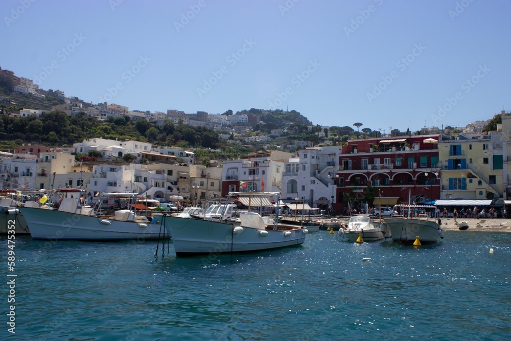 Beautiful shot of boats along the beautiful shore of Capri Island, Naples, Italy