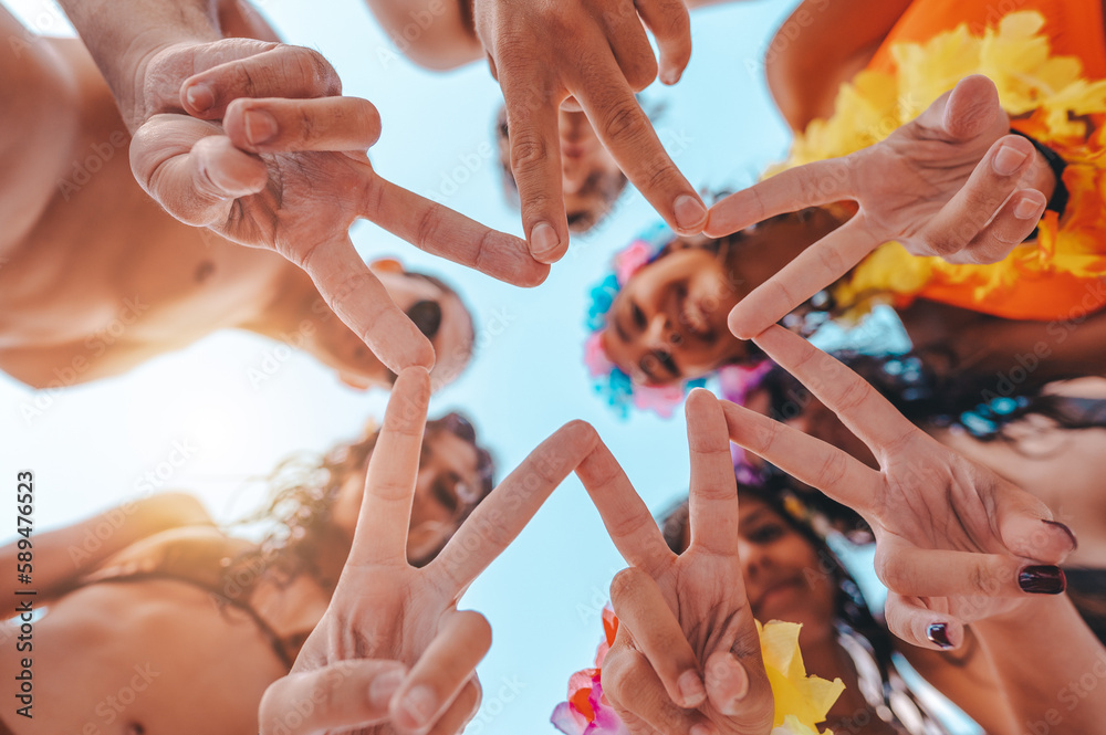 Fototapeta premium Happy smiling friends together with the hands at the beach