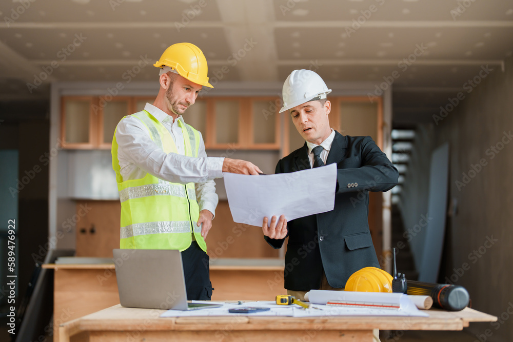 multi ethnic engineer brainstorming and measuring for cost estimating on blueprint and floor plan drawings about design architectural and engineering for houses and buildings multi ethnic engineer brainstorming and measuring for cost estimating on blueprint and floor plan drawings about design architectural and engineering for houses and buildings