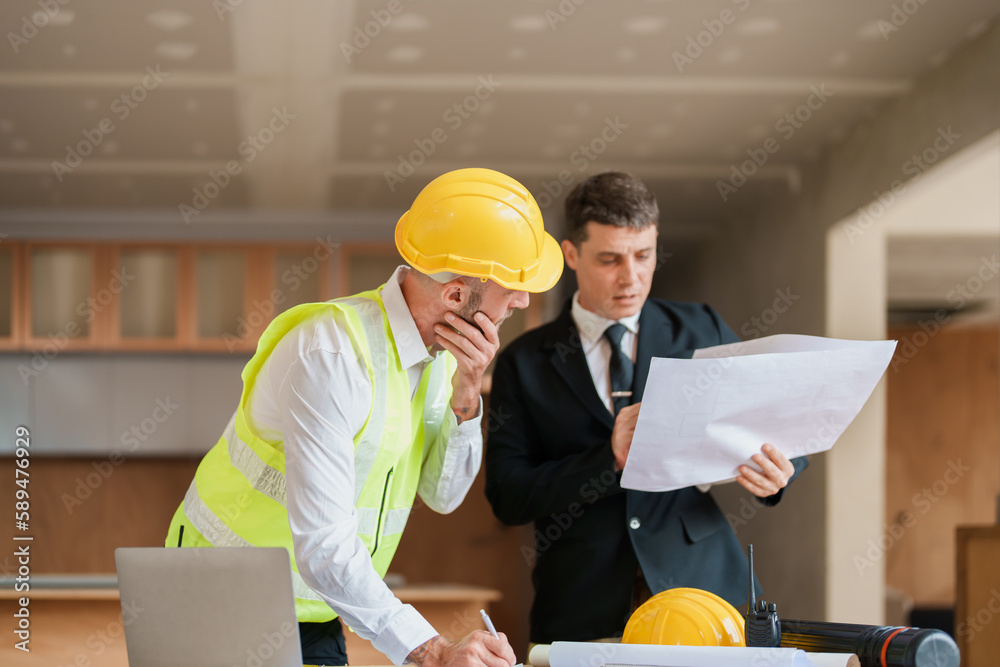 multi ethnic engineer brainstorming and measuring for cost estimating on blueprint and floor plan drawings about design architectural and engineering for houses and buildings multi ethnic engineer brainstorming and measuring for cost estimating on blueprint and floor plan drawings about design architectural and engineering for houses and buildings