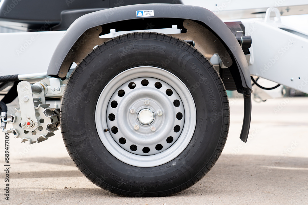 Industrial lift new fresh trailer tire from side Industrial lift new fresh trailer tire from side
