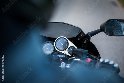 behind the back of a motor bike driver i the movement on the side road