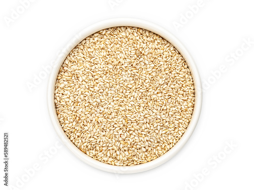White sesame in a white bowl on a white background, isolate, close-up, top view. Flat lay.