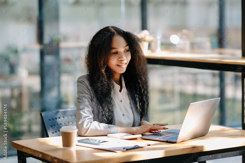 Obraz premium Business woman using tablet and laptop for doing math finance on an office desk, tax, report, accounting, statistics, and analytical research concept in office
