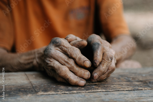 Close up of male wrinkled hands, old man is wearing skin disease and anxiety Copy space.