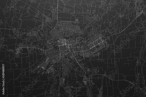 Street map of Lugansk (Ukraine) on black paper with light coming from top