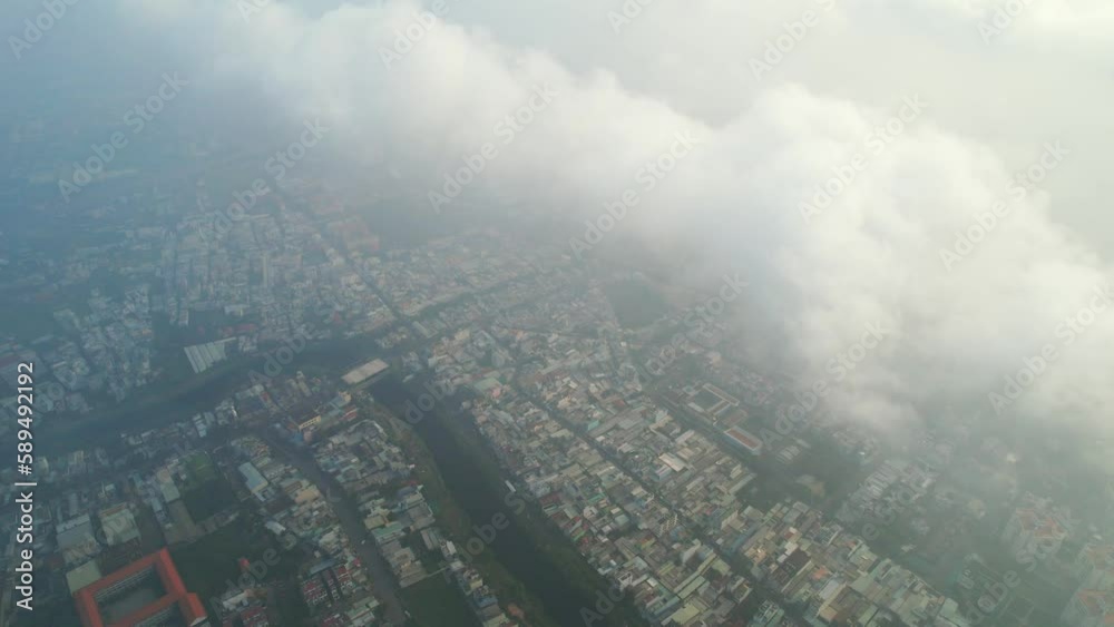 Aerial view of Saigon cityscape at morning with misty sky in Southern Vietnam. Urban development texture, transport infrastructure and green parks Aerial view of Saigon cityscape at morning with misty sky in Southern Vietnam. Urban development texture, transport infrastructure and green parks