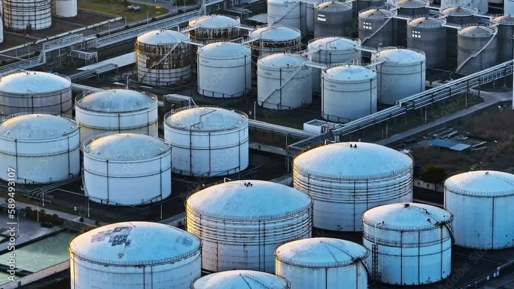 Aerial view oil terminal storage tank, White oil tank storage chemical petroleum petrochemical refinery product at oil terminal. Aerial view oil terminal storage tank, White oil tank storage chemical petroleum petrochemical refinery product at oil terminal.