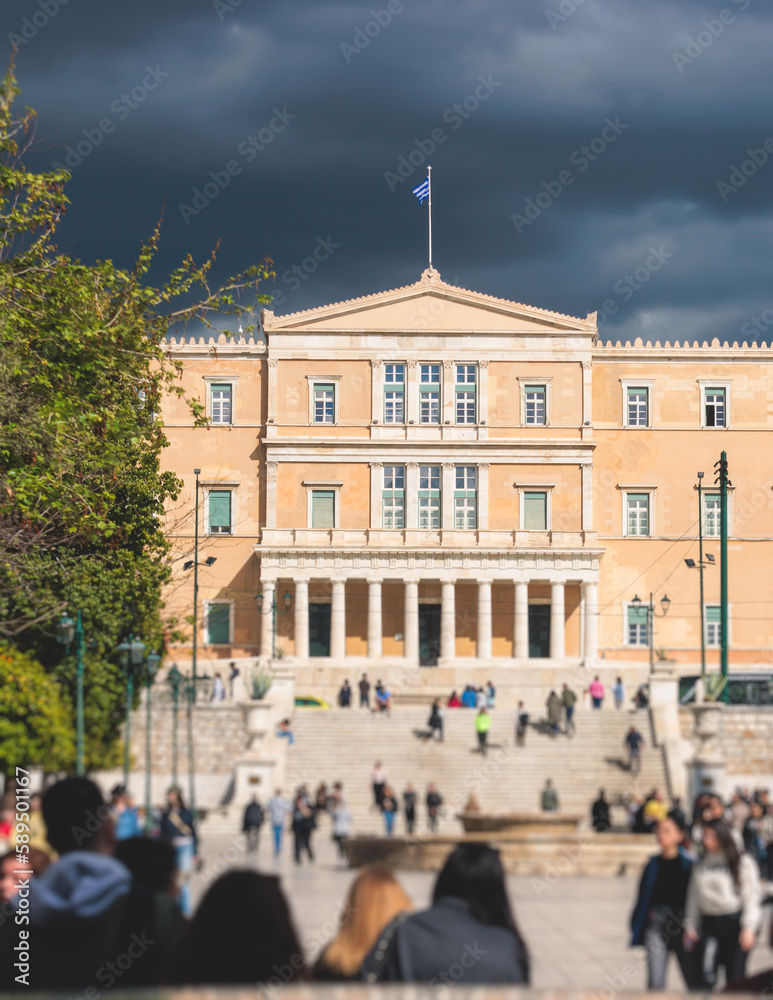 Fototapeta premium Greek Parliament in Old Royal Palace building facade exterior, Hellenic Bouleterion parliament house on Syntagma square, Athens, Attica, Greece in a summer day