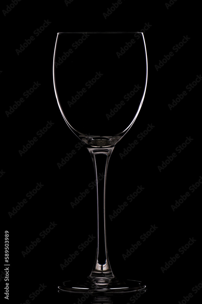 Empty wine glass in black background