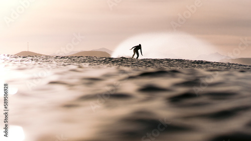 View of Dreamy surfer girl silhouette on the board in the Pacific ocean waiting for the wave in glorious morning light, Baja California Sur, Mexico. photo