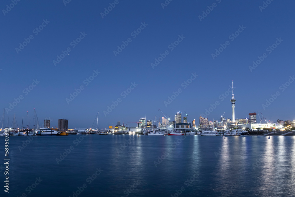 View of Auckland skyline from the Marina harbour at sunset, New Zealand. View of Auckland skyline from the Marina harbour at sunset, New Zealand.