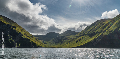 View of a sunlit Unalaska Island coastline, Unalaska, Alaska, United States. photo