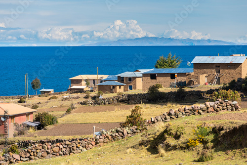 Houses with fields on Amantani island, Lake Titicaca, Puno, Peru photo