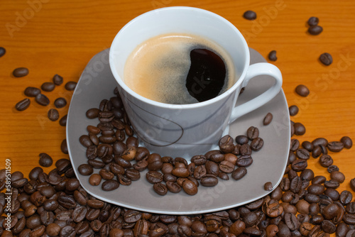 Morning coffee with coffee beans in the picture