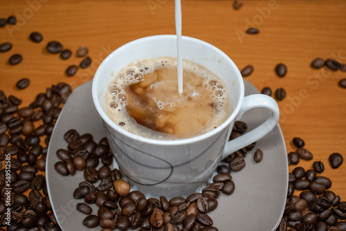 Fototapeta Naklejka Na Ścianę i Meble -  Morning coffee with coffee beans in the picture