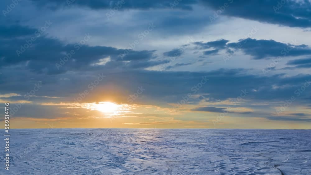 wide snowbound plain at the sunrise, cold winter natural time lapse scene wide snowbound plain at the sunrise, cold winter natural time lapse scene