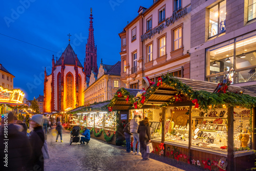 View of Christmas market and Maria Chappel in Oberer Markt at dusk, Wurzburg, Bavaria, Germany photo
