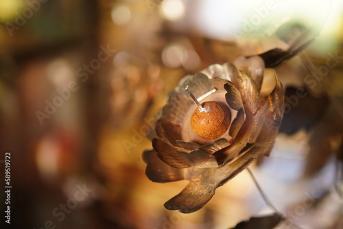 Flowers made of brass plates for background images.