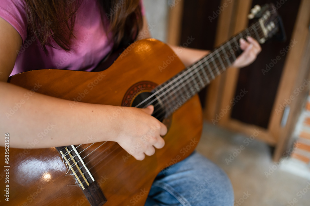 Obraz premium Happy young Woman hands playing acoustic guitar musician alone compose instrumental song lesson on playing the guitar