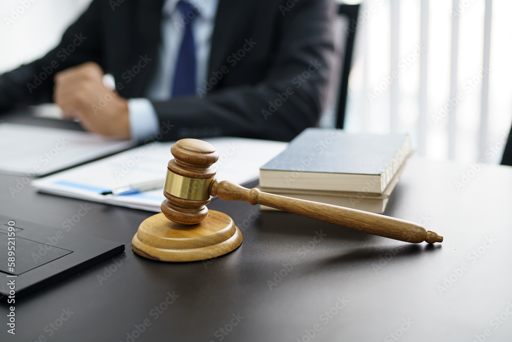 Lawyer Legal counsel presents to the client a signed contract with gavel and legal law. justice and lawyer Business partnership meeting concept. Lawyer Legal counsel presents to the client a signed contract with gavel and legal law. justice and lawyer Business partnership meeting concept.