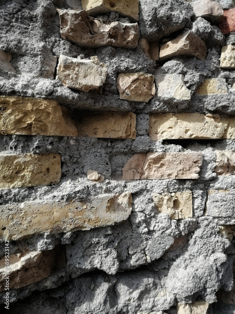 Detail of the section of a concrete and brick wall, demolished for the renovation of a building. Detail of the section of a concrete and brick wall, demolished for the renovation of a building.