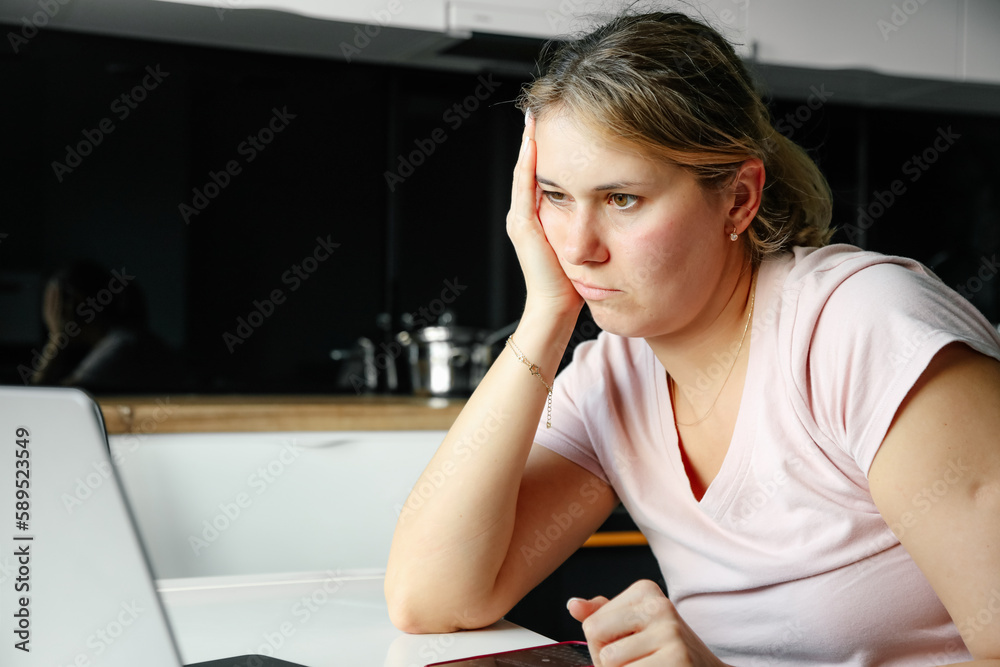 Use of modern technologies. Pretty woman works at home online. Home office. Professional burnout. Creative crisis. Use of modern technologies. Pretty woman works at home online. Home office. Professional burnout. Creative crisis.