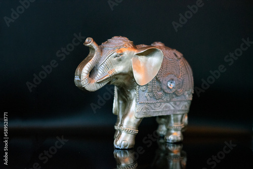 elephant figurine isolated on a black background