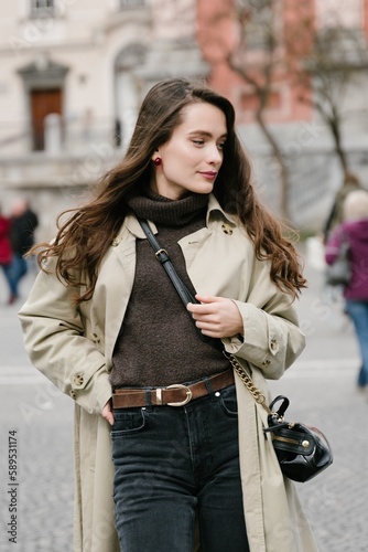 Young beatiful woman portrait in the historical city centre of Ljubljana in trendy outfit