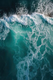Spectacular aerial top view background photo of ocean, white wave splashing in the deep sea. 