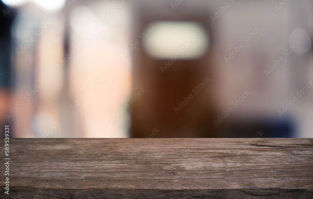 Empty dark wooden table in front of abstract blurred bokeh background of restaurant . can be used for display or montage your products.Mock up for space.