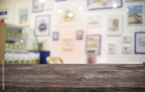 Empty wood table top and blur of night market background/selective focus .For montage product display. © Charlie's