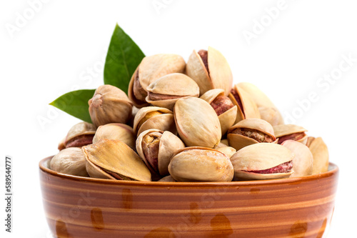 Pistachio in bowl on white background