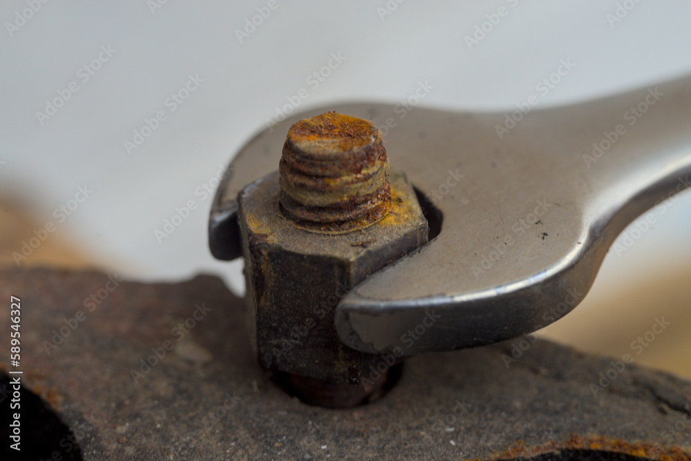 Chrome wrench and the nut on exhaust system Chrome wrench and the nut on exhaust system