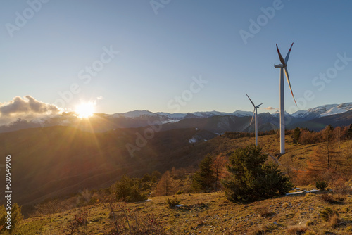 Wind turbines in mountains, Alps, Italy