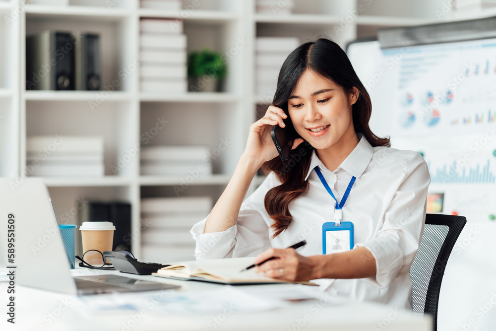 Young businesswoman are stressed and tired from work sitting at desk in the office, feeling pain at work, Young businesswoman are stressed and tired from work sitting at desk in the office, feeling pain at work,