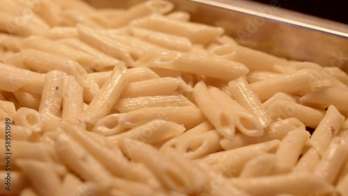 A delectable bed of penne, perfectly cooked to al dente perfection.