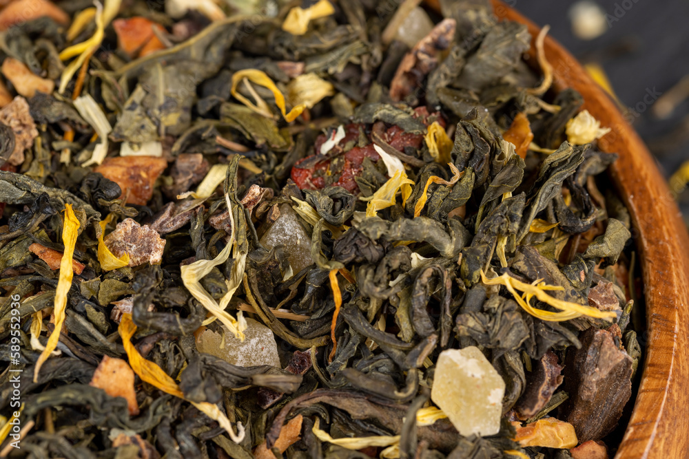 fresh green tea with pieces of fruit and berries