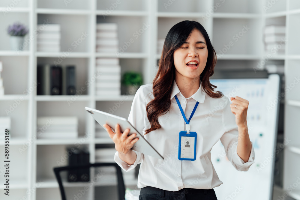 Young woman happy and screaming because of problems with documents in the office. Young woman happy and screaming because of problems with documents in the office.